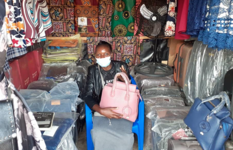 Woman selling products at the Karonga market