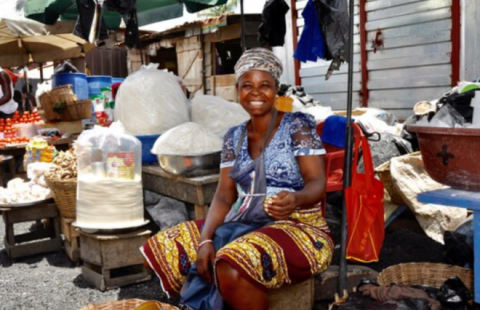 African woman smiling on market