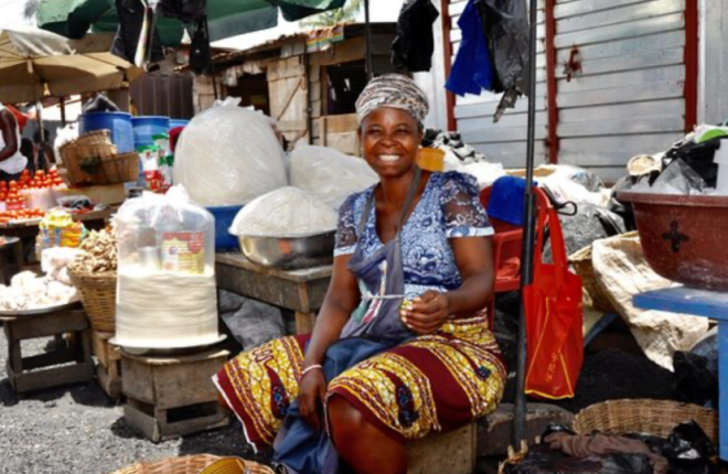 African woman smiling on market